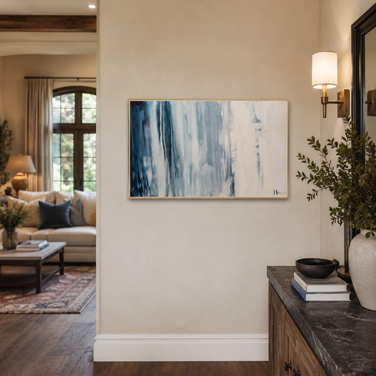 Navy and cream abstract painting by Jen Bell in a hallway entry.
